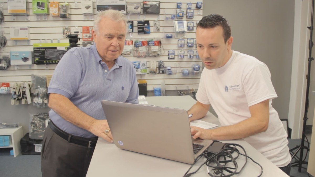 Advantron employee helping a customer at the front counter
